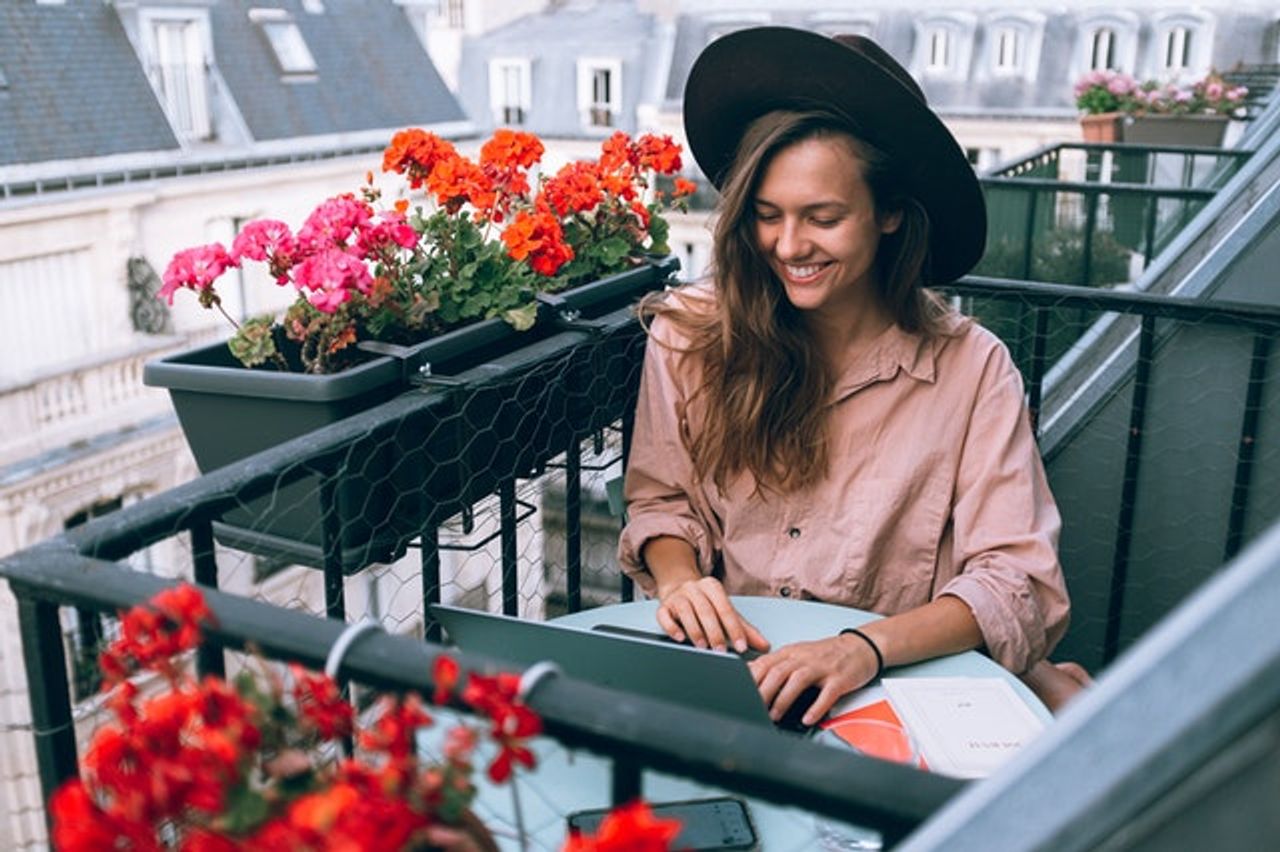 woman-wearing-beige-dress-shirt-using-laptop-computer-3277932