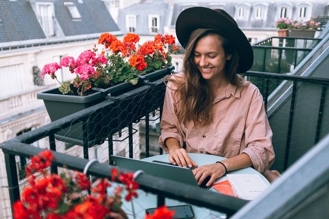 woman-wearing-beige-dress-shirt-using-laptop-computer-3277932
