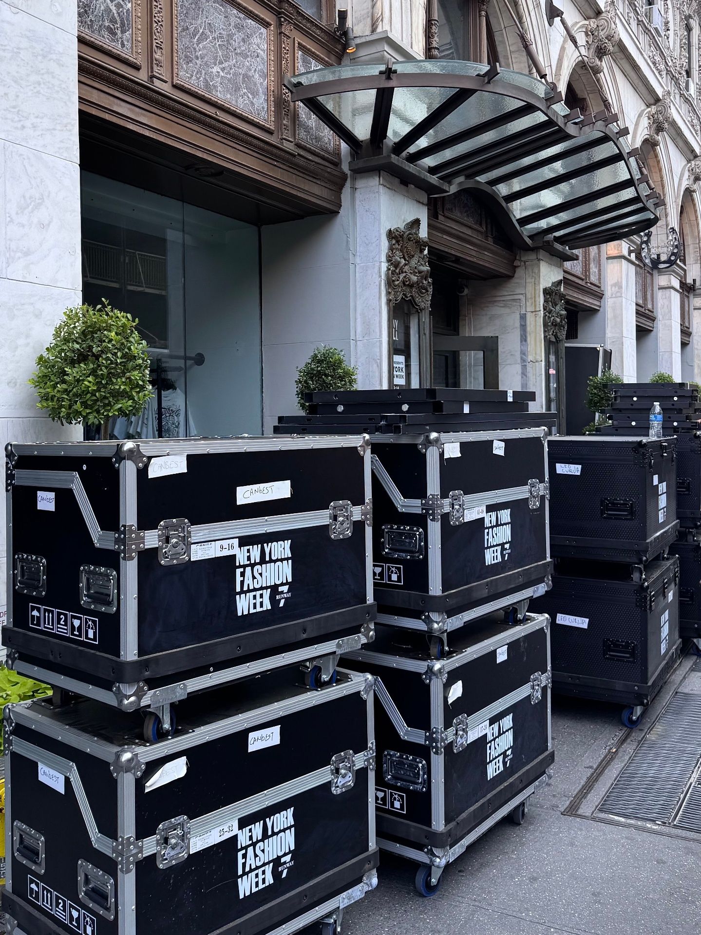 Stacked production road cases arriving on location for a large event load-in