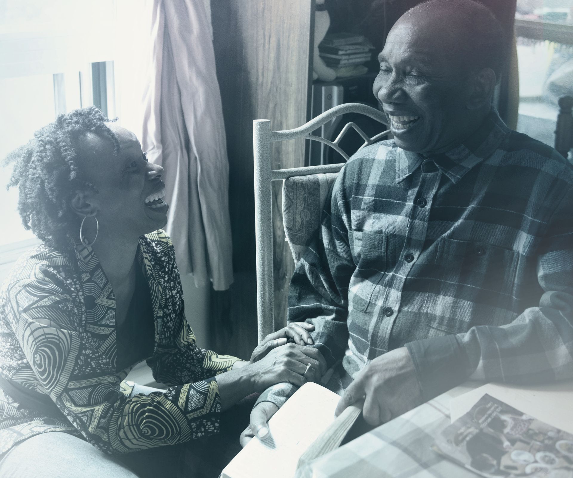 Two people laughing together