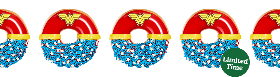 Wonder Woman™ Doughnut with red raspberry icing, blue sprinkles, white stars, and topped with a Wonder Woman™ belt and emblem