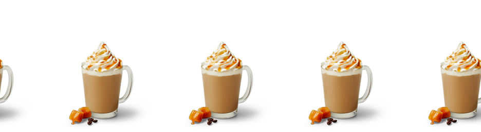 Multiple Caramel lattes with whipped cream and caramel drizzle on top