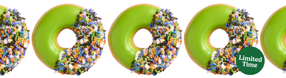 Spooky Sprinkle Krispy Kreme Halloween Doughnut - Green Icing and Halloween Sprinkles on a glazed doughnut