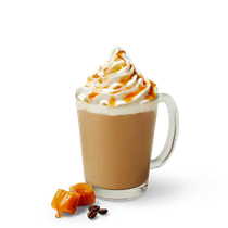 Caramel latte with whipped cream and caramel drizzle on top