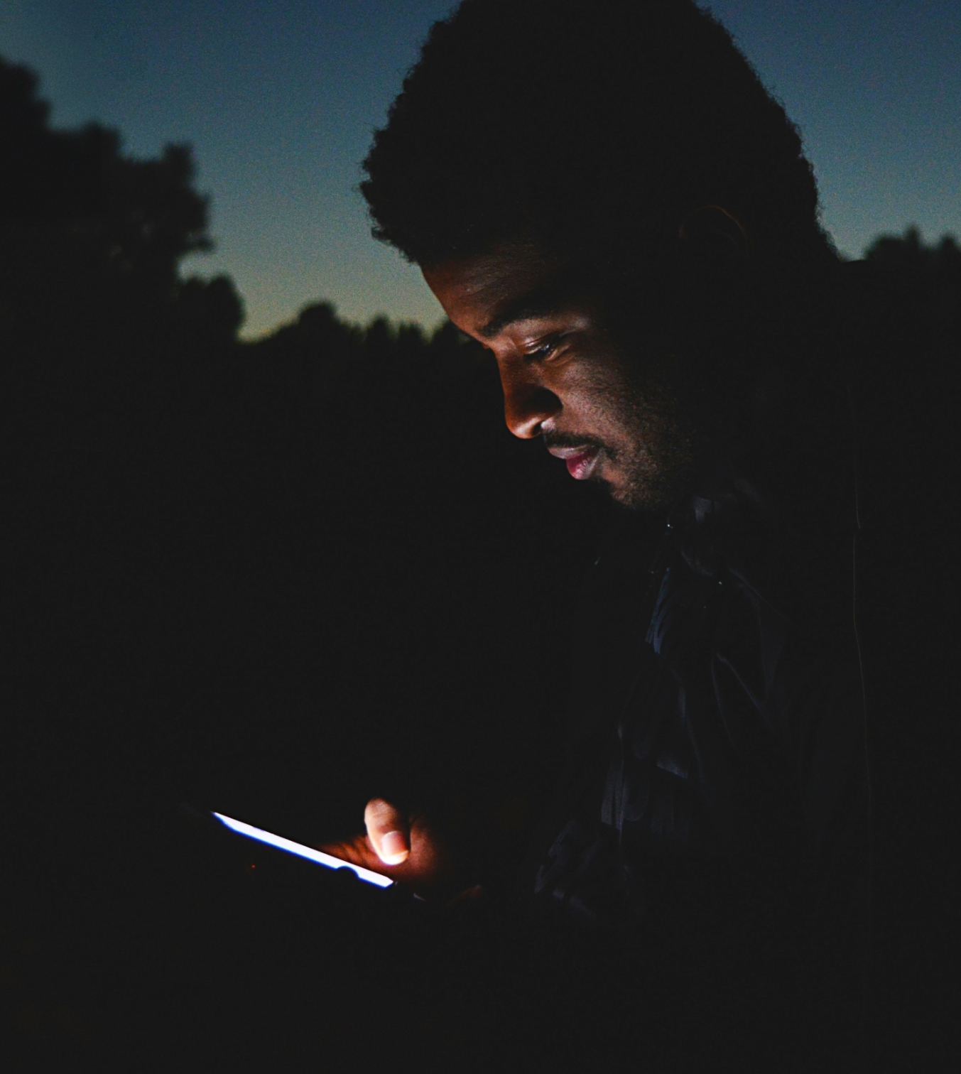 An image of a person holding a phone