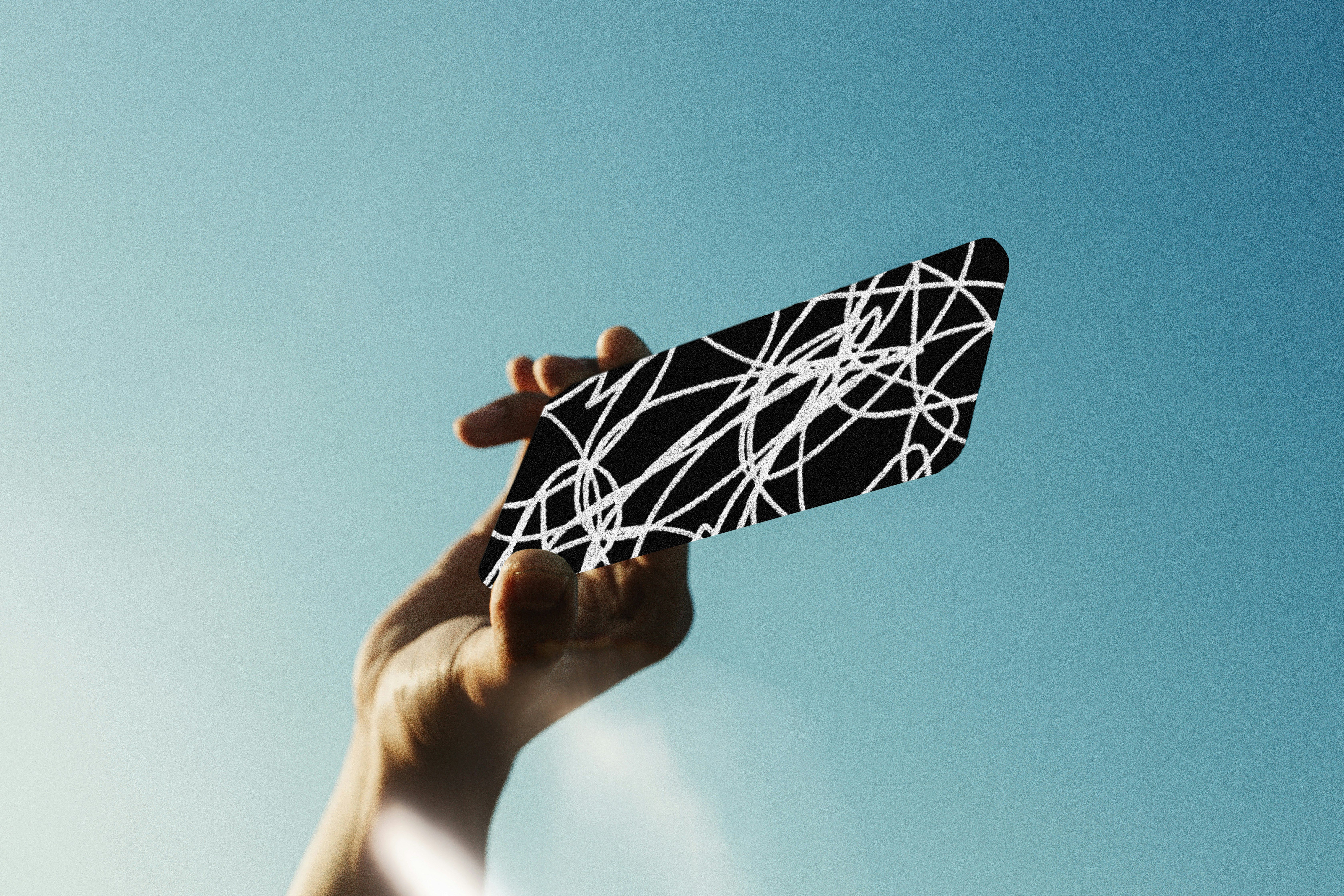 hand holding up a scribbled-out phone.