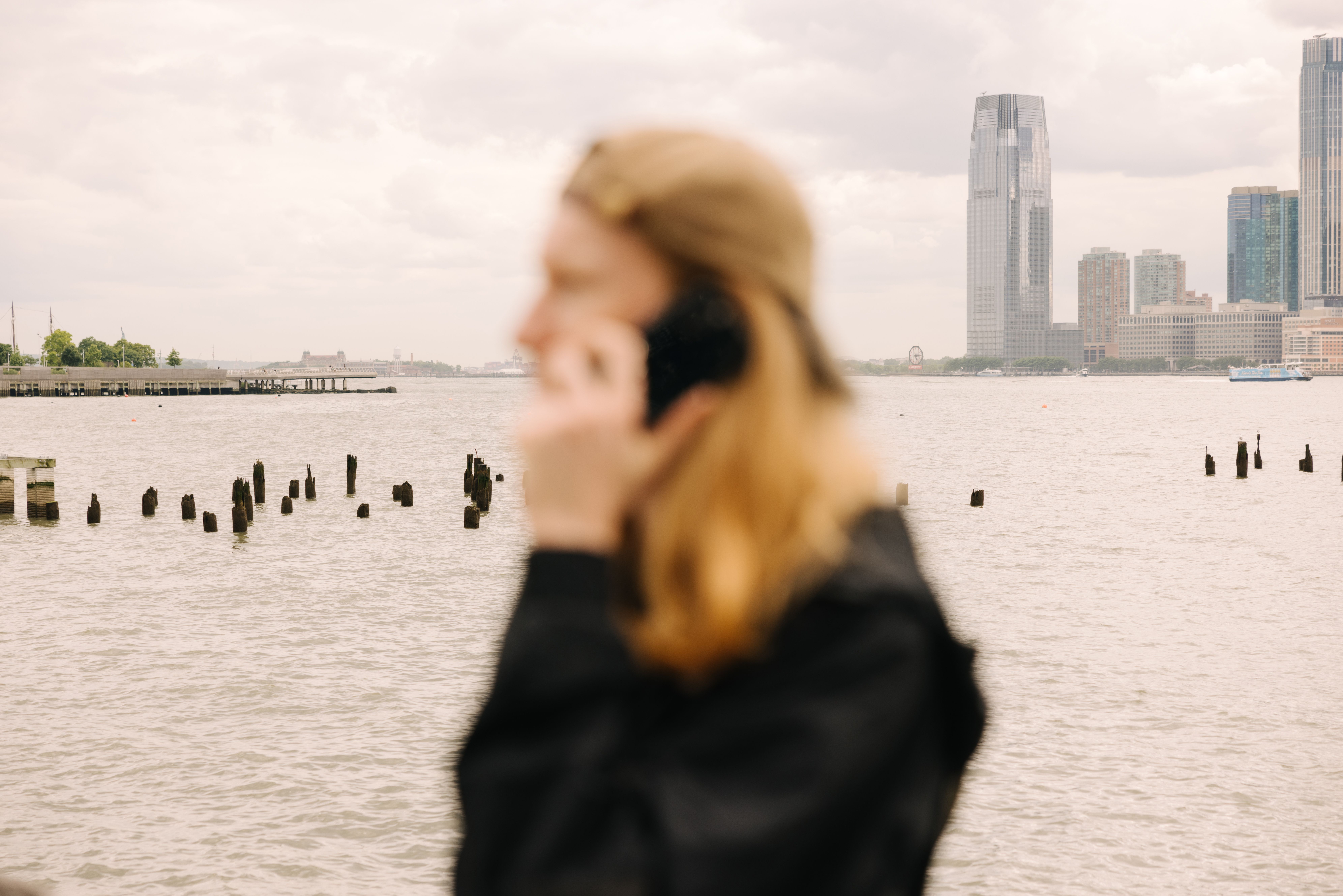 An image of a person holding a phone secured by Cape.