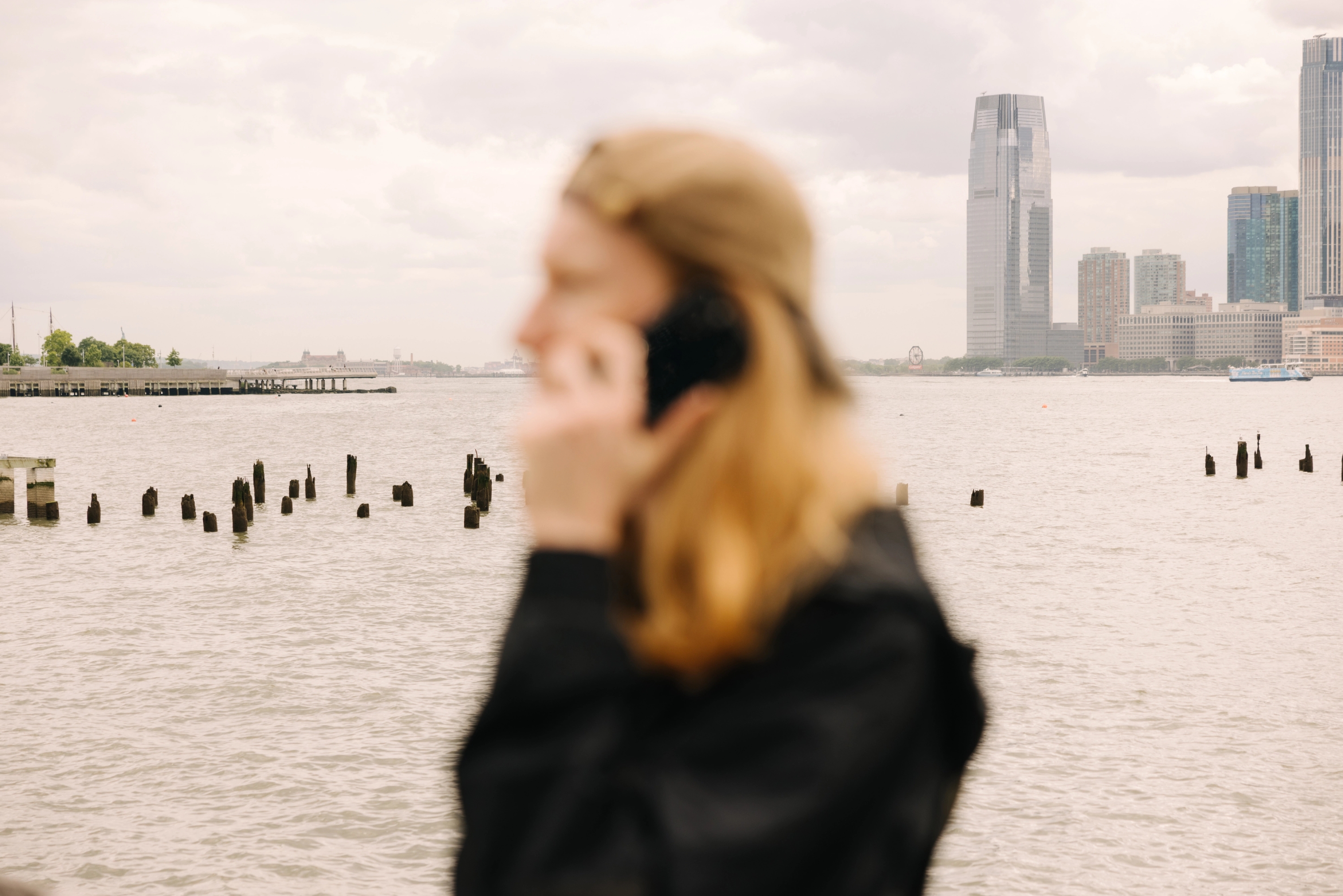 An image of a person holding a phone secured by Cape.
