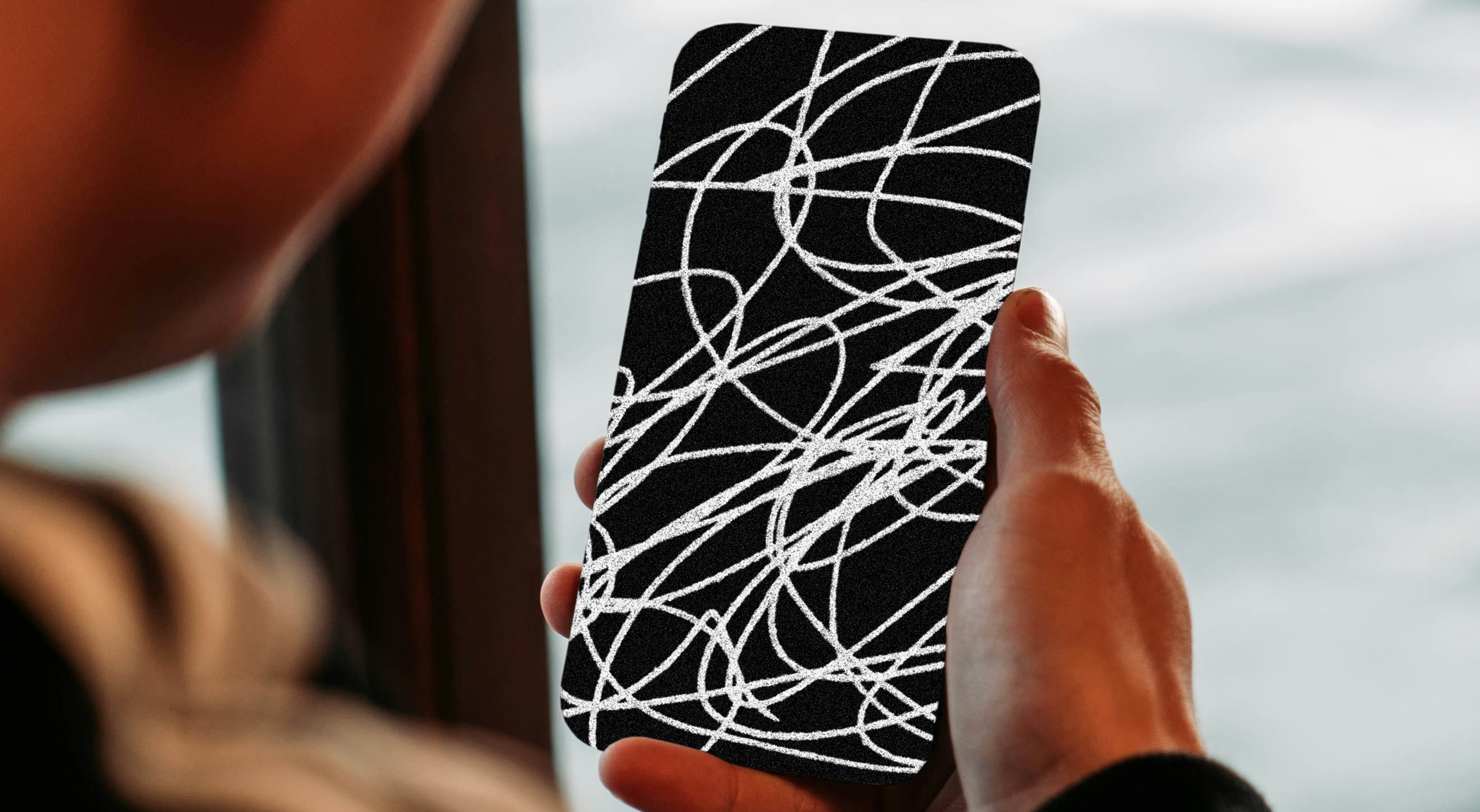 An image of a phone obscured by scribbles