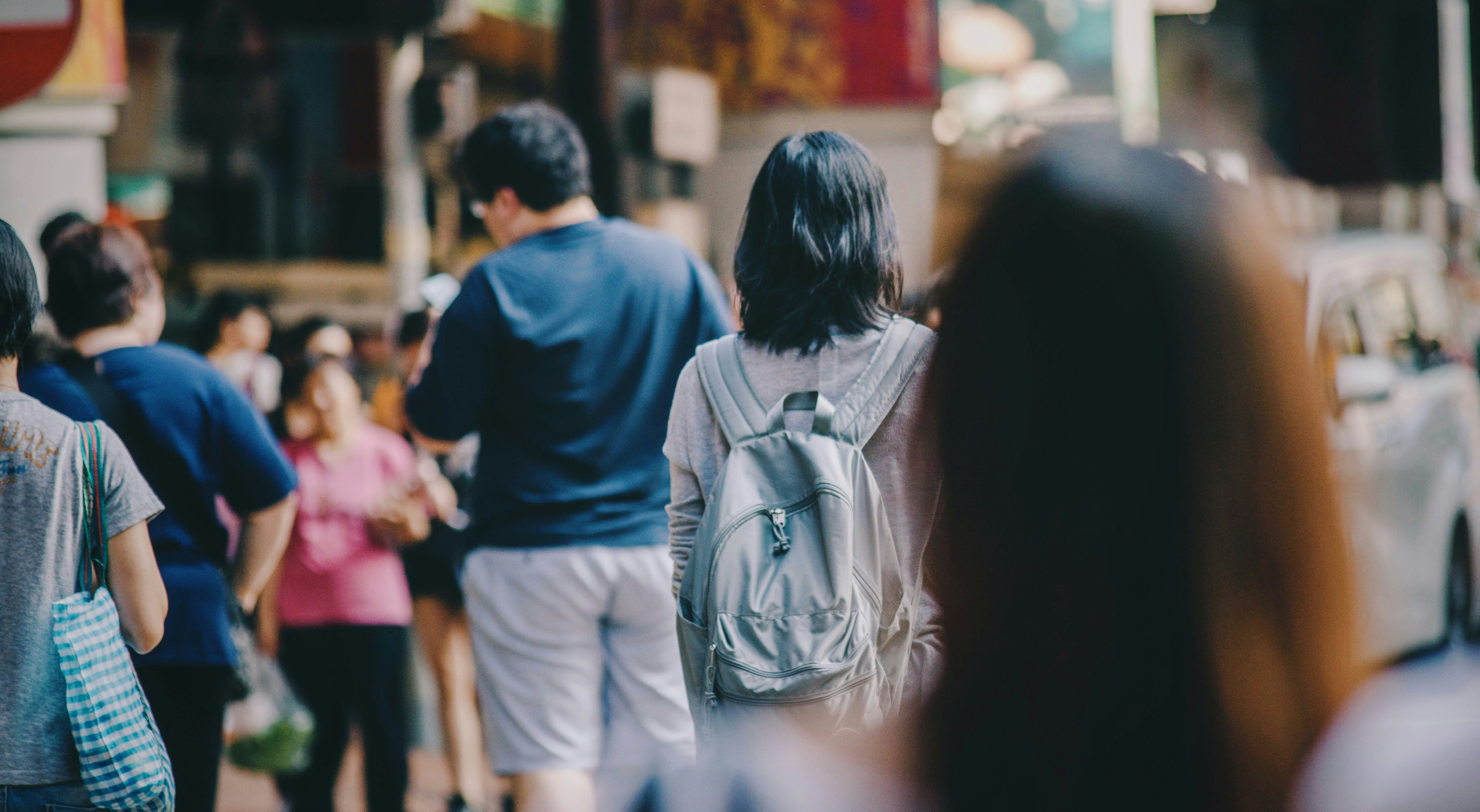 An image of people walking in a crowd.