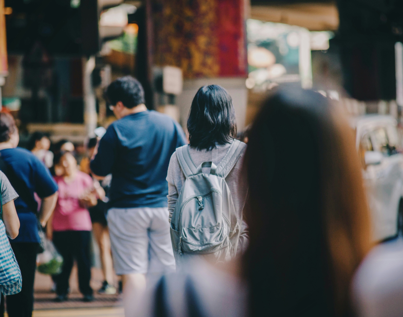 An image of people walking in a crowd.