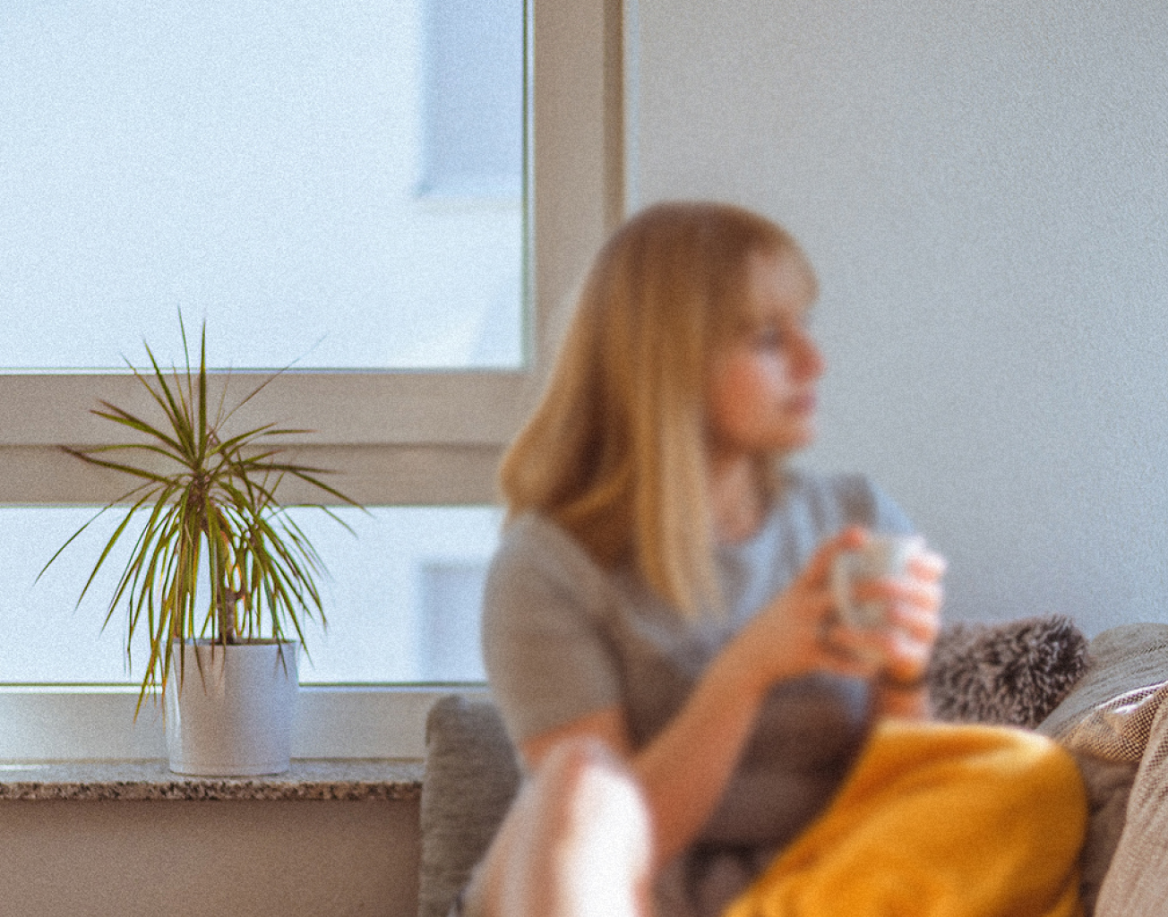 An image of a person holding a phone that is obscured by abstract scribbles