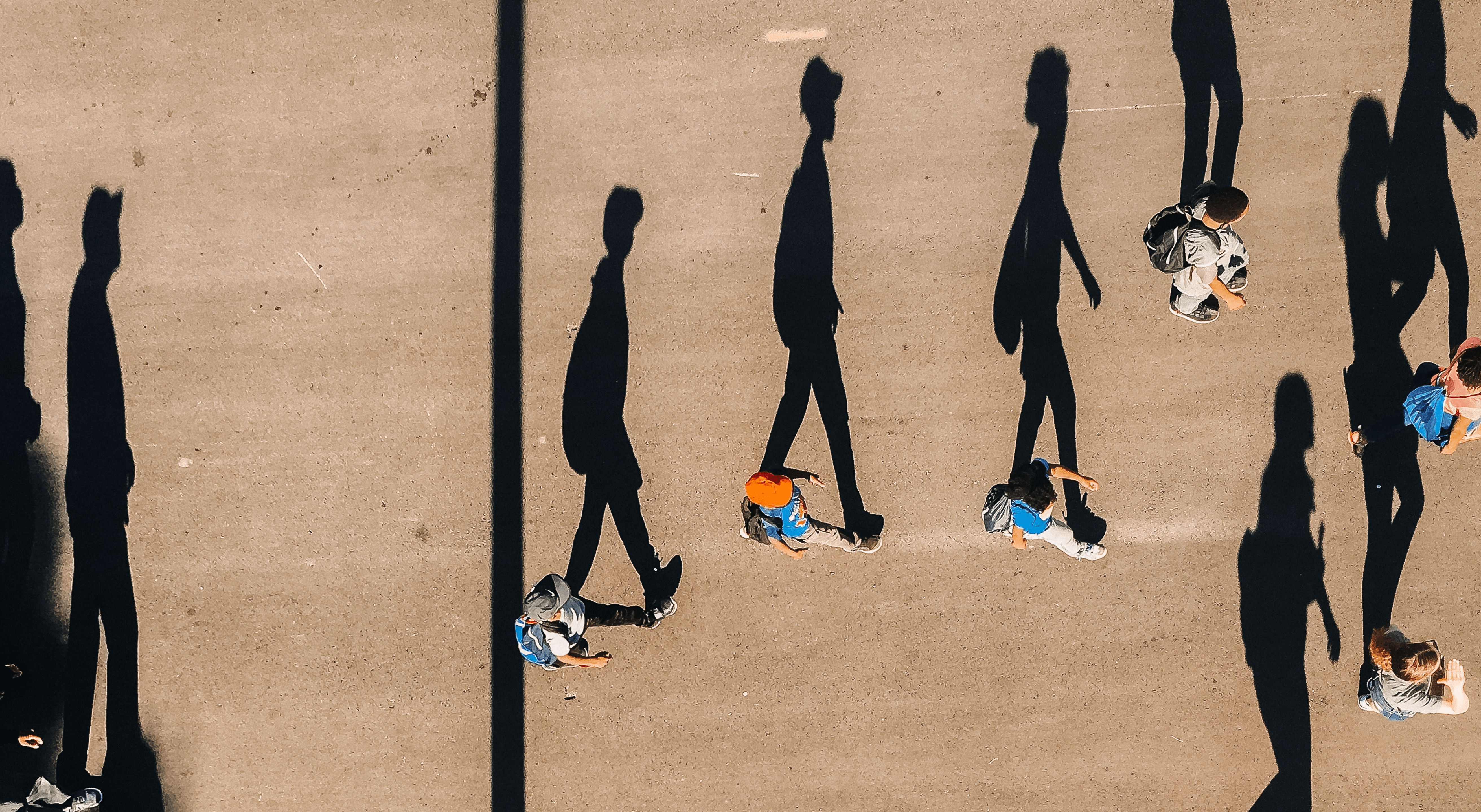A photo of people walking taken from above