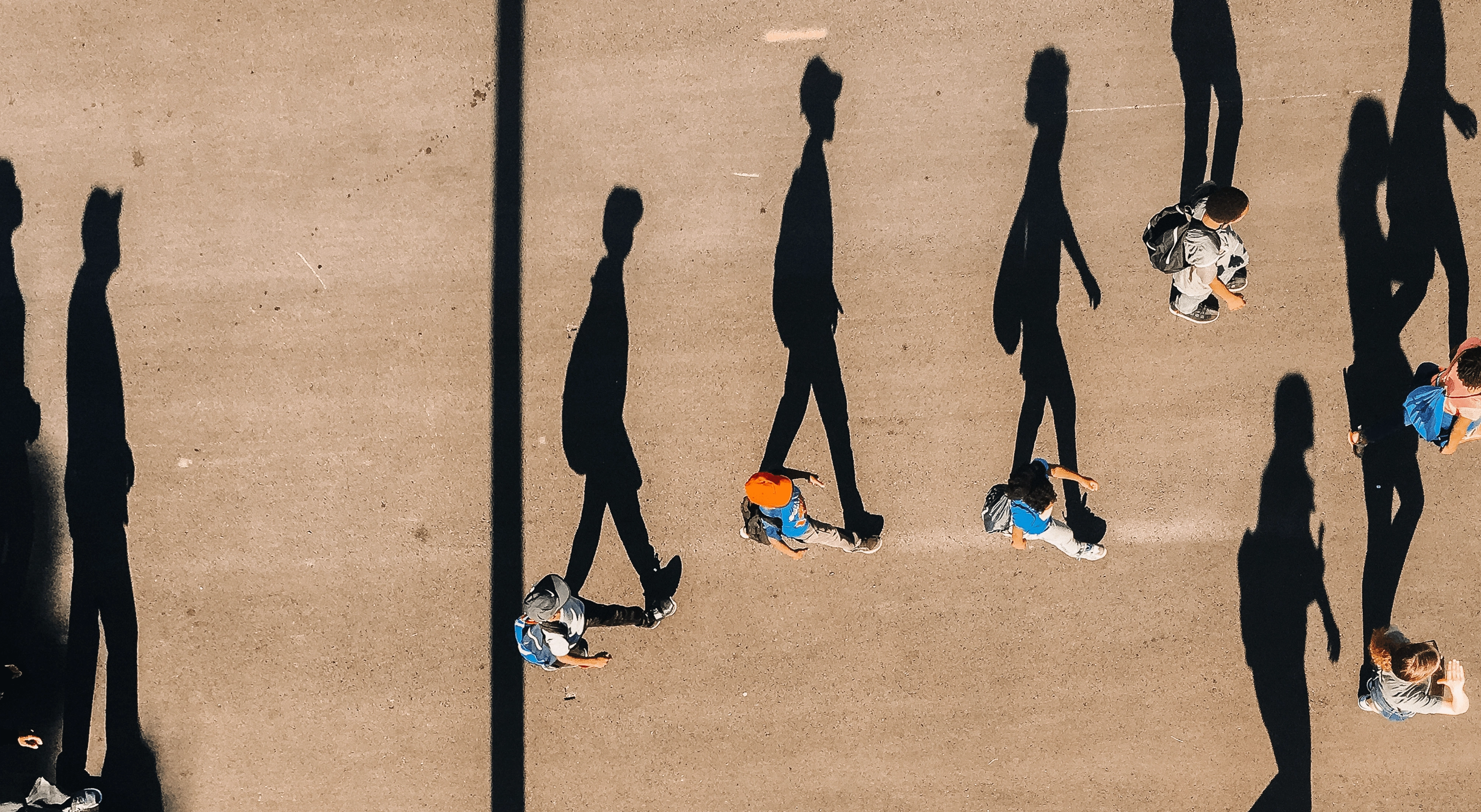 A photo of people walking taken from above