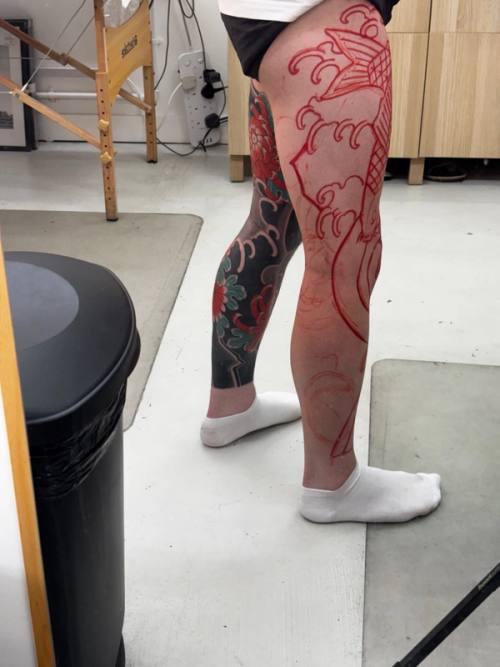 Back of the left leg, the chrysanthemum stencil sitting low on the calf