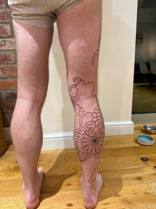 Back of the legs after session one, chrysanthemum outline on the right calf and the rest still bare
