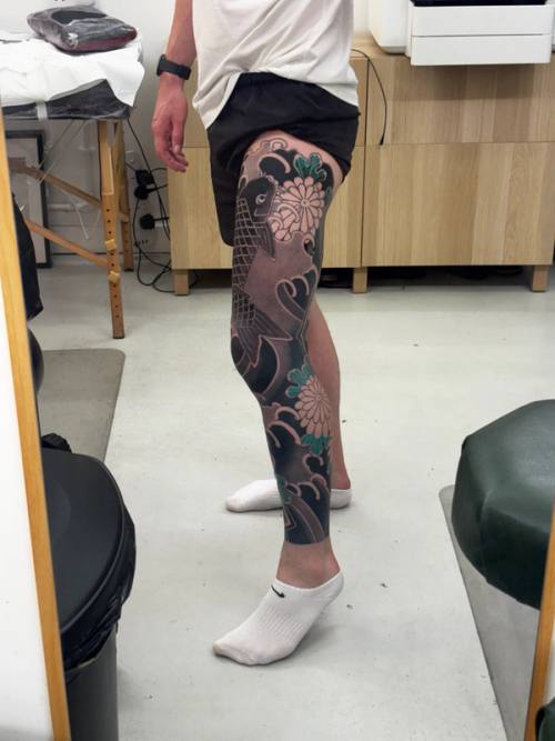 Right leg sleeve in the studio after day two, the koi shaded and the first green in the chrysanthemum petals