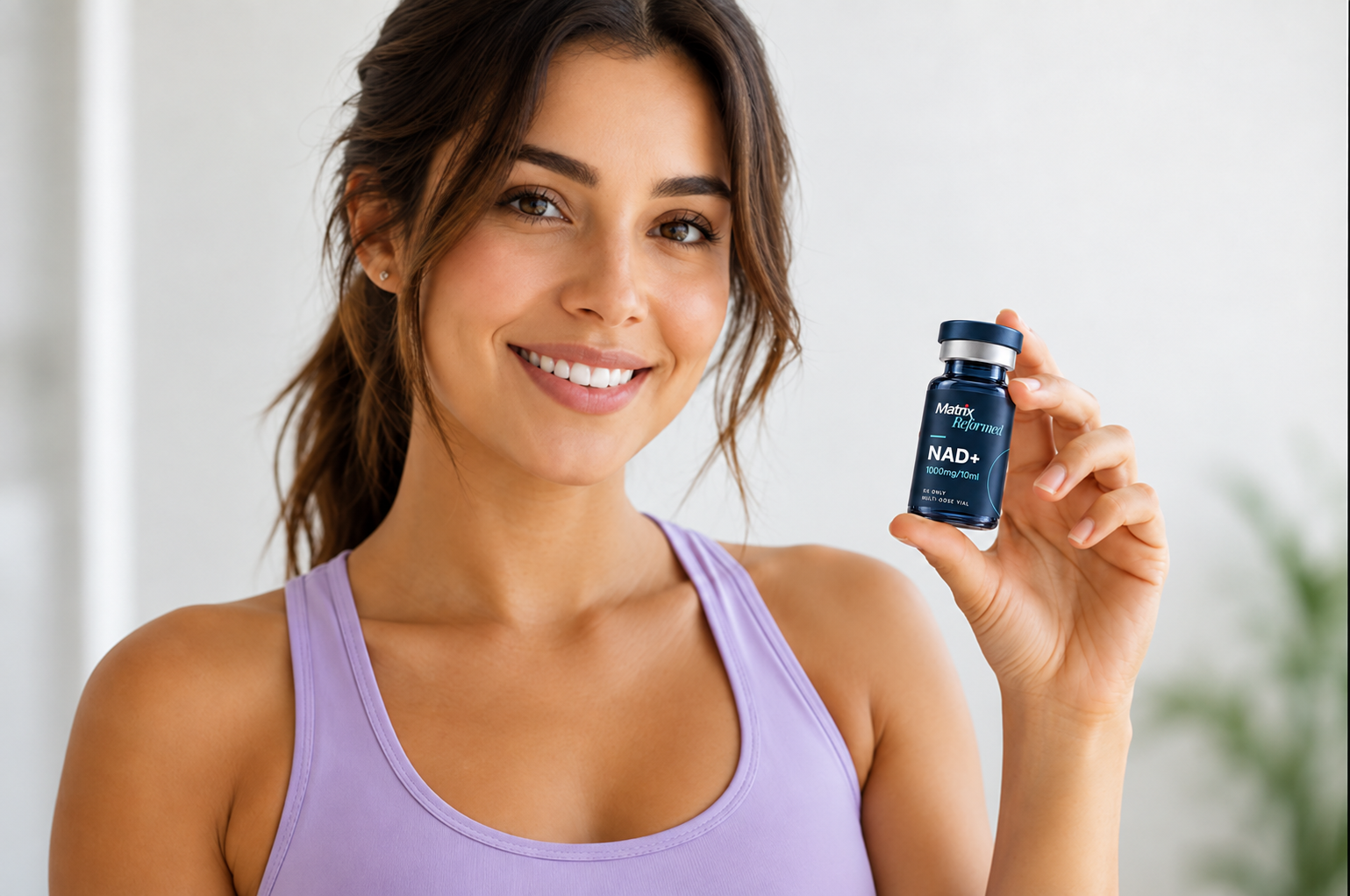 Smiling young man holding a semaglutide medication vial for weight management treatment