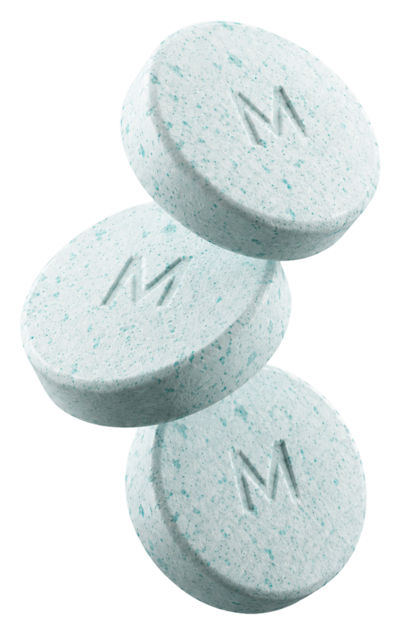 Three stacked speckled tablets with an embossed M logo.