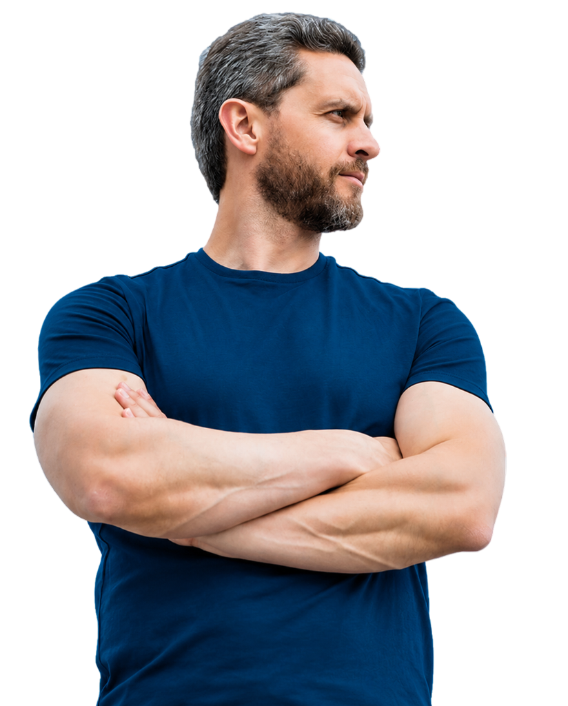 Confident man standing with crossed arms in a blue shirt.