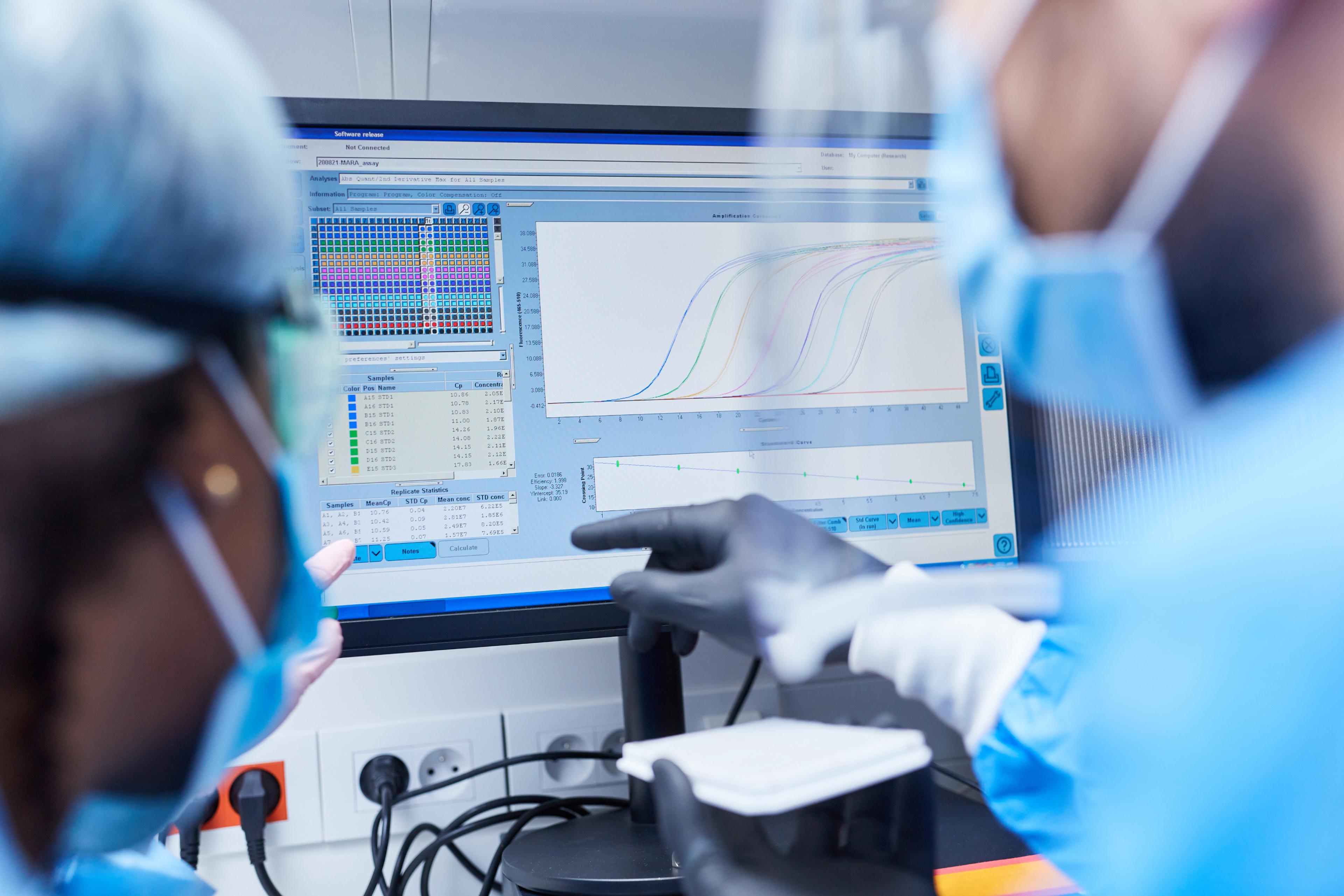 Scientist pointing at screen