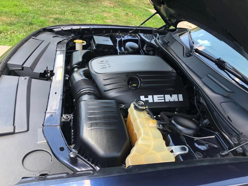 Detailed engine bay after service with degreased components dressed plastic trim and clean firewall