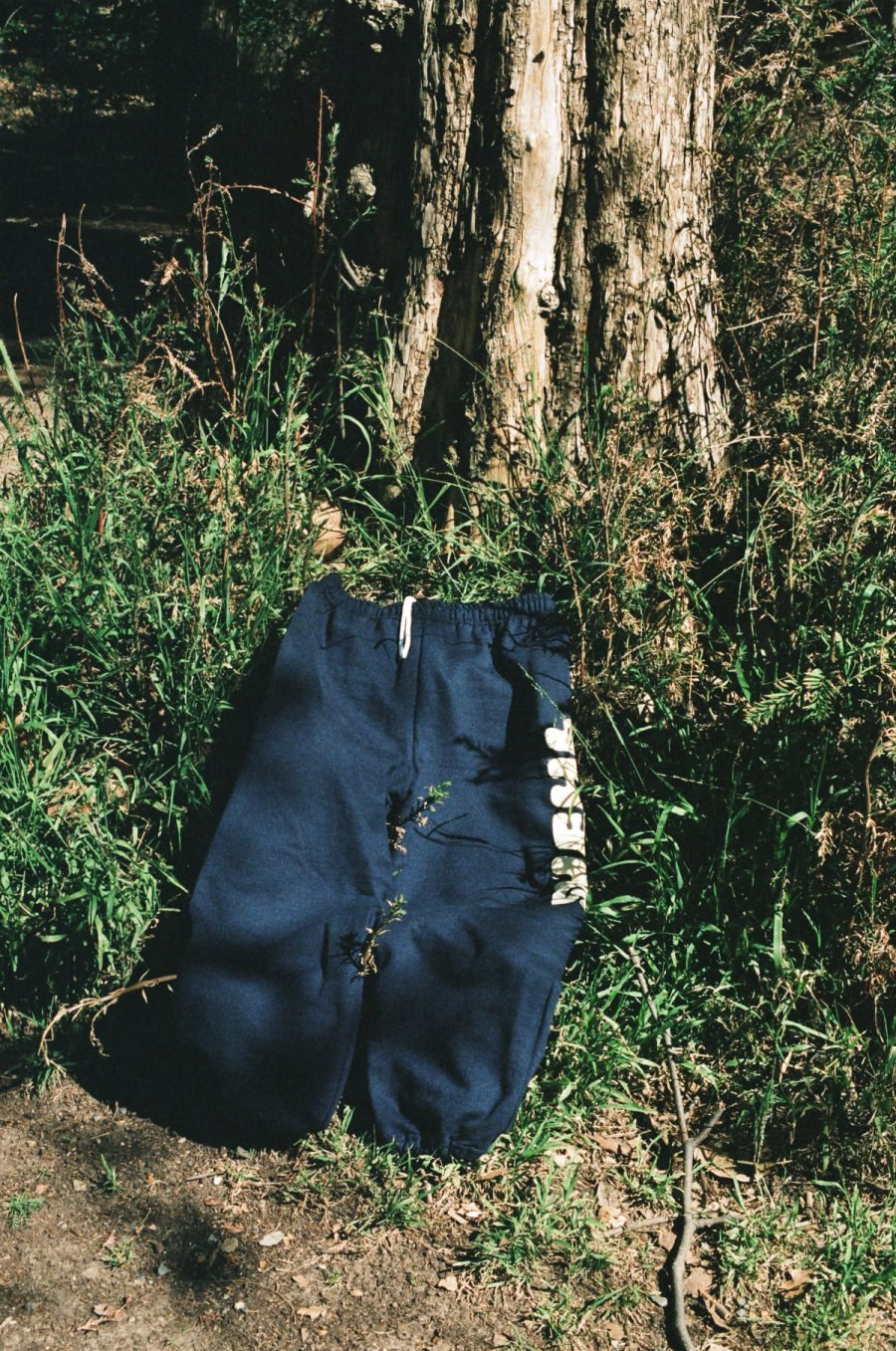 a woman standing next to a table with plates on it