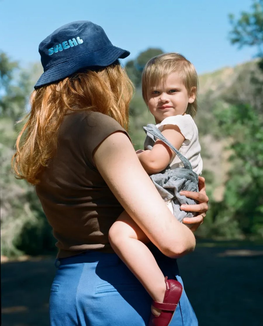a woman holding a small child in her arms