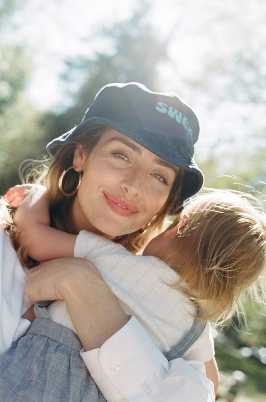 a woman holding a baby in her arms