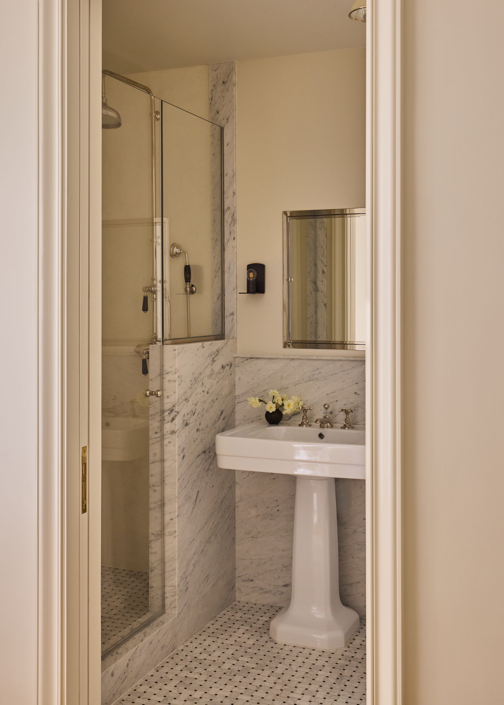 Bathroom with carrara basketweave tile and pedestal sink