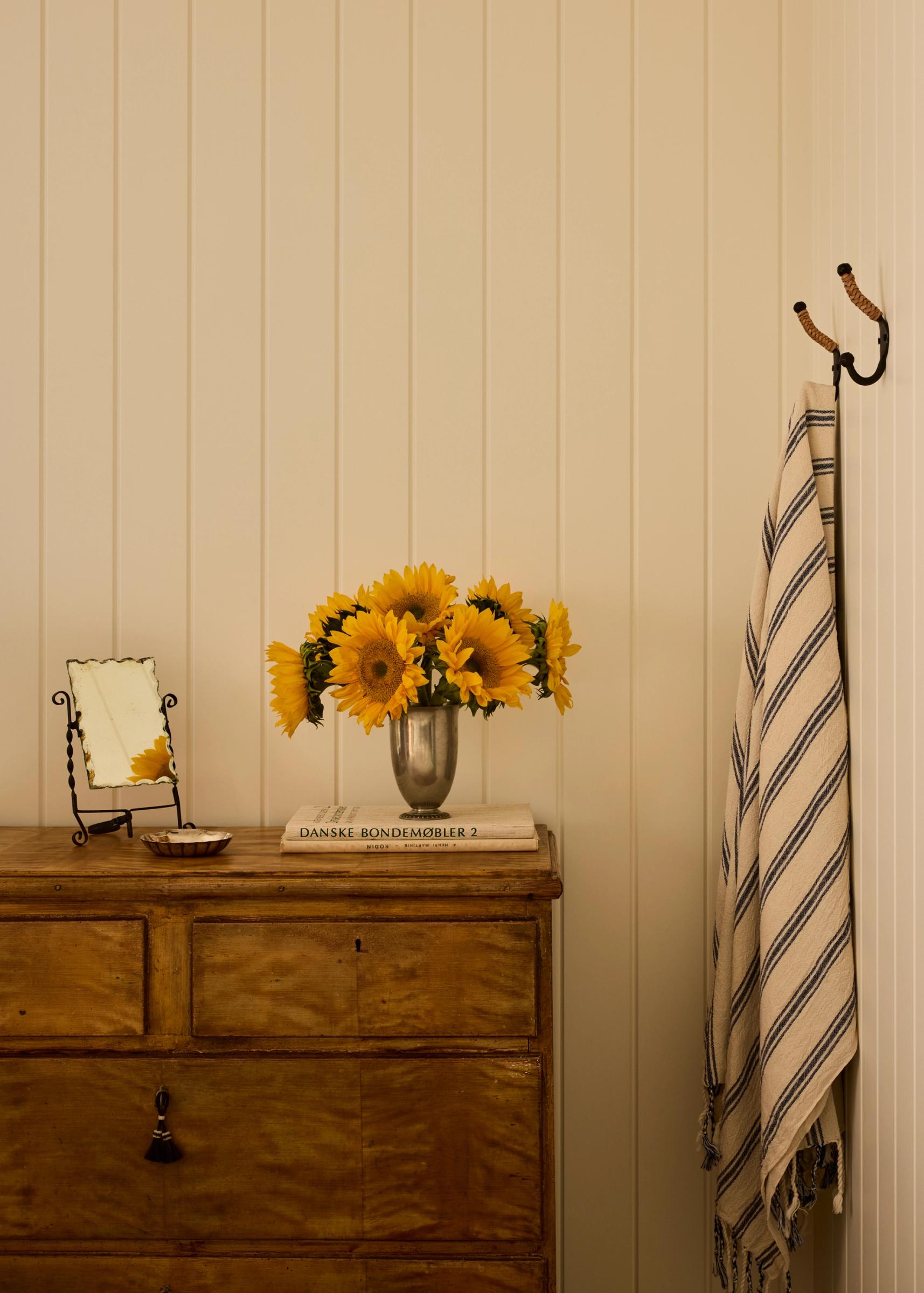 Antique Dresser with sunflower on top
