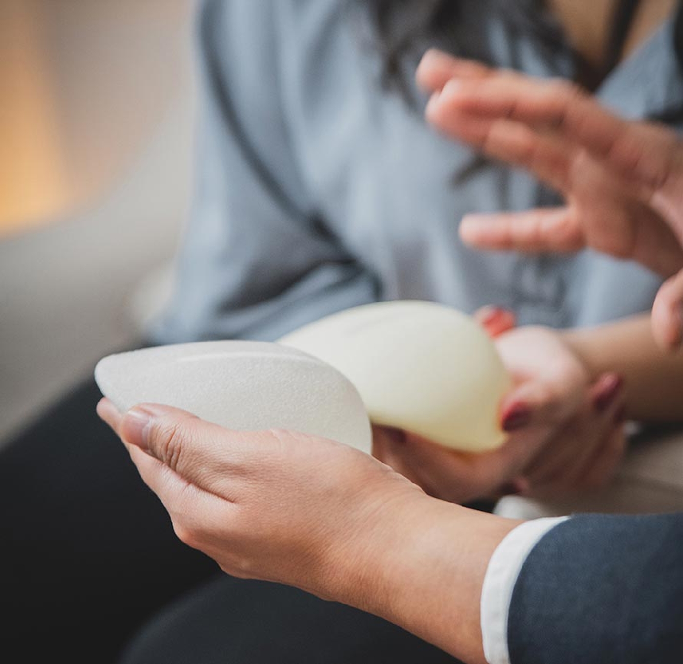 Doctor holding implant in his hand close up