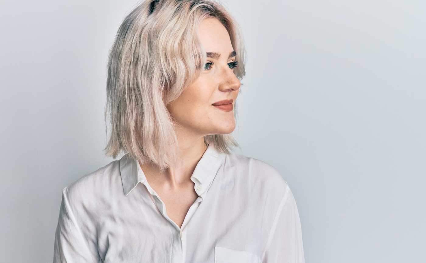 Woman smiling to the right