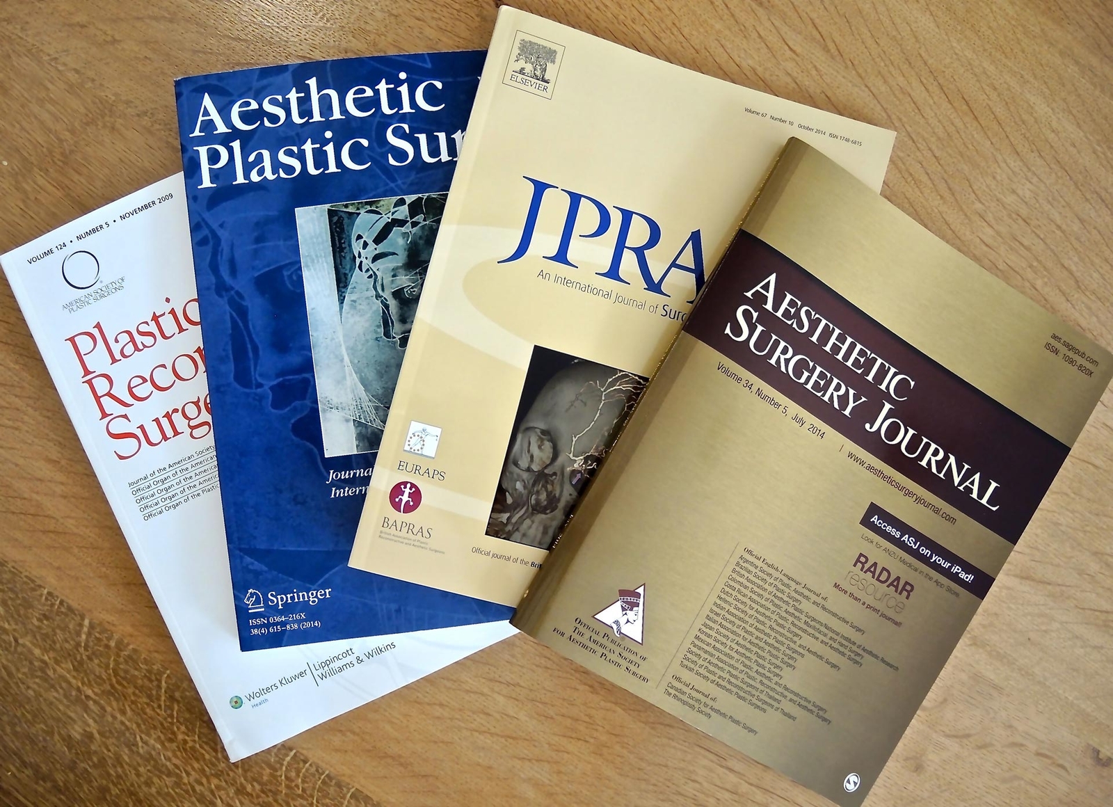 Four textbooks laid on a table