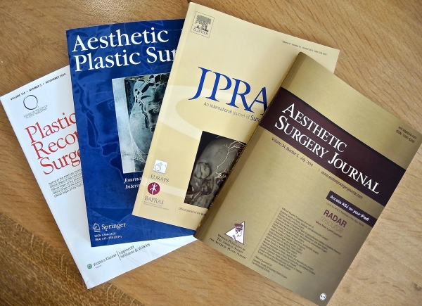 Four textbooks laid on a table