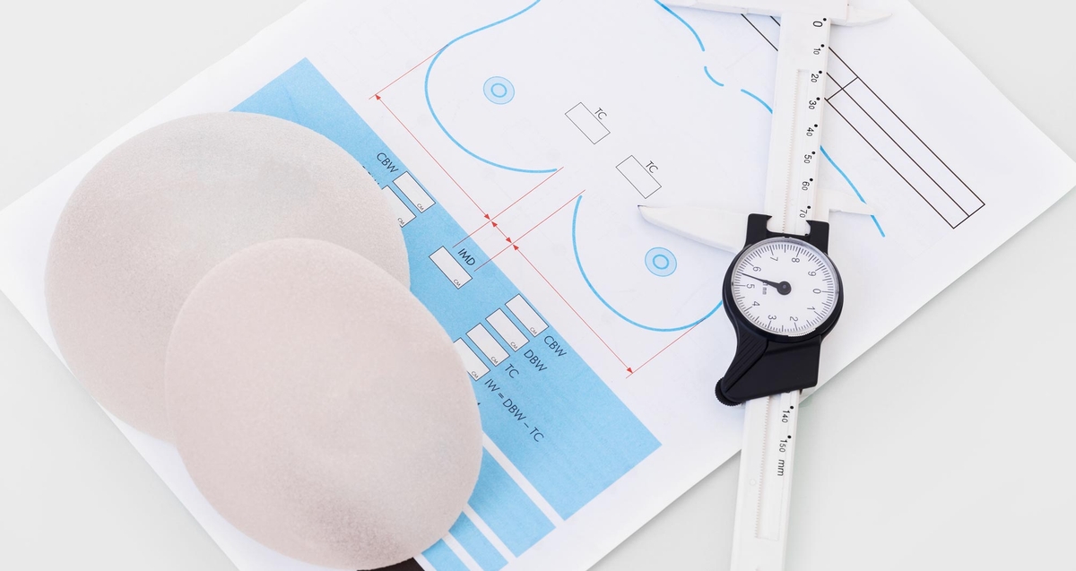 Breast implants on a piece of paper
