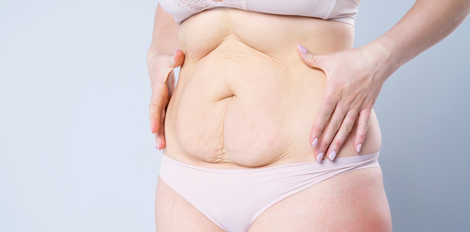 Woman holding her abdomen