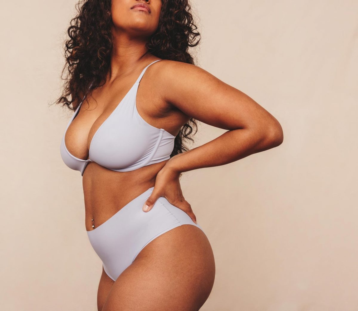 Woman posing in undergarments