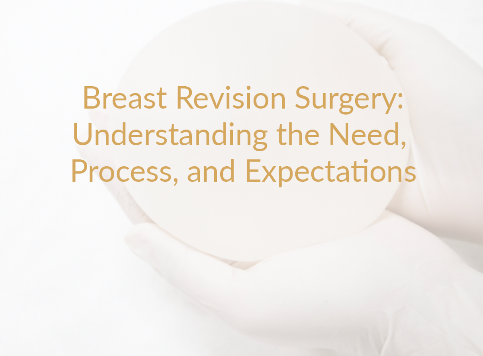 White gloves holding a breast implant in a studio setting