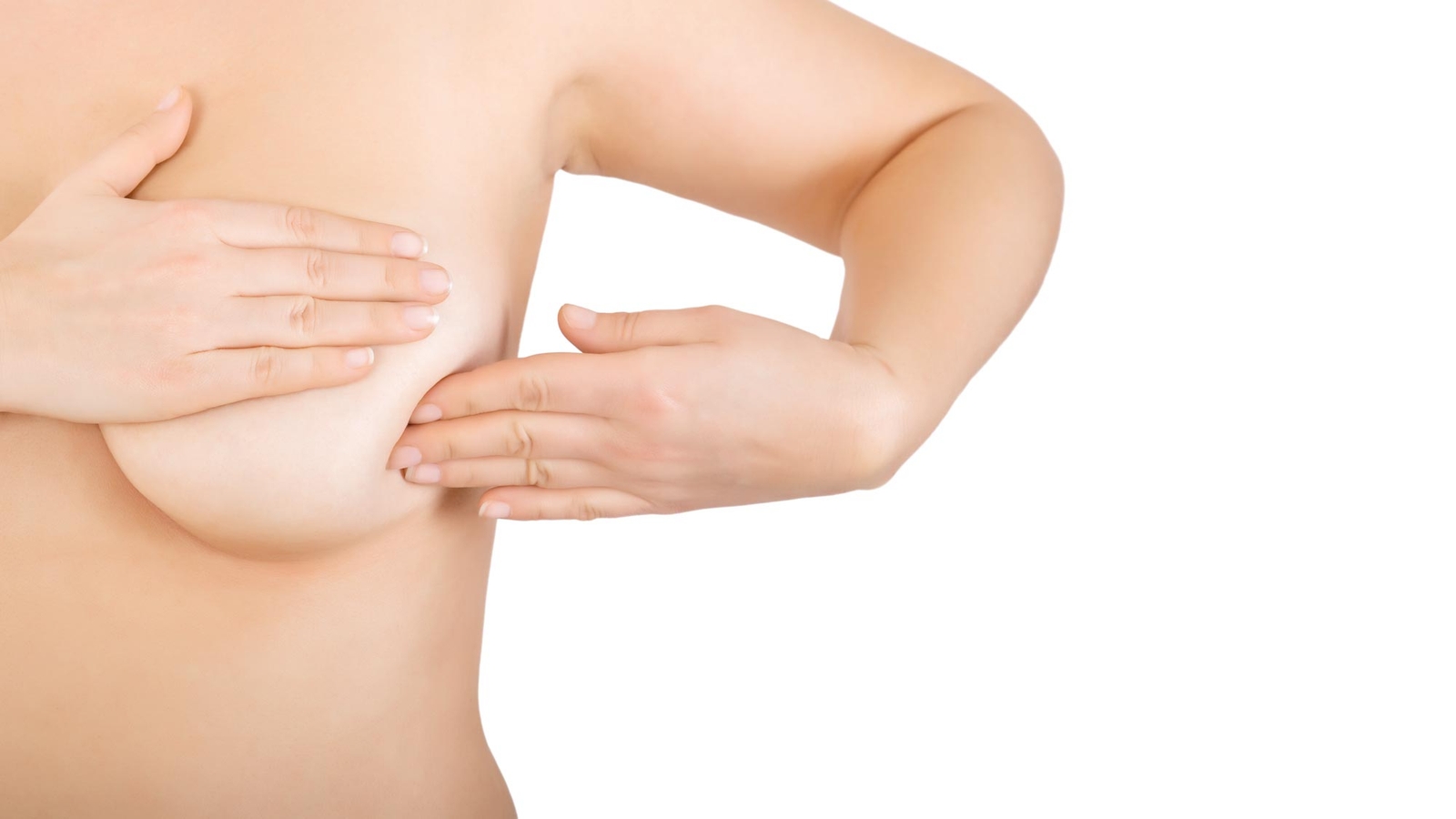 Woman holding her breast