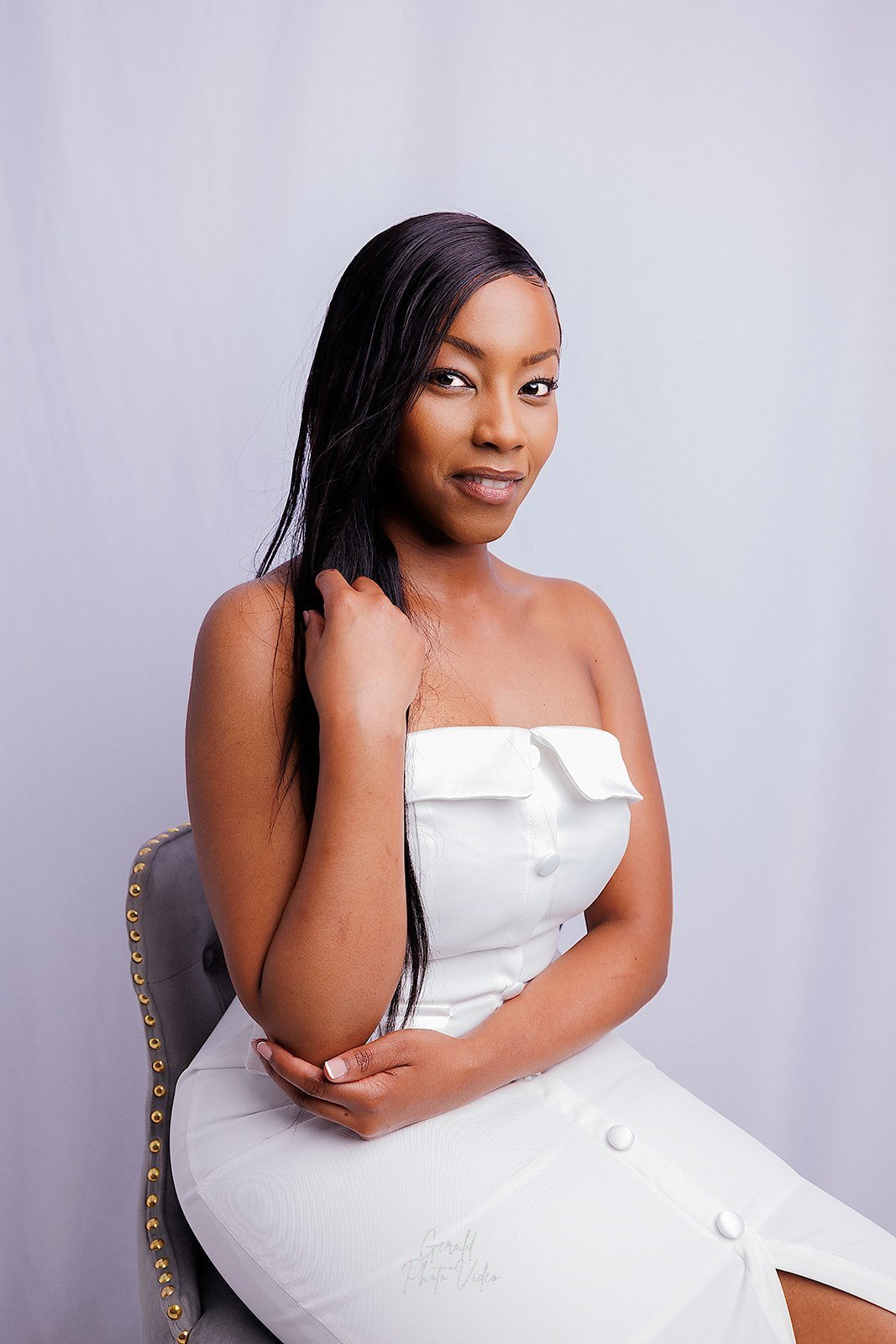 Elegant studio portrait in a white dress by Gerald Photo Video, Omaha portrait photographer