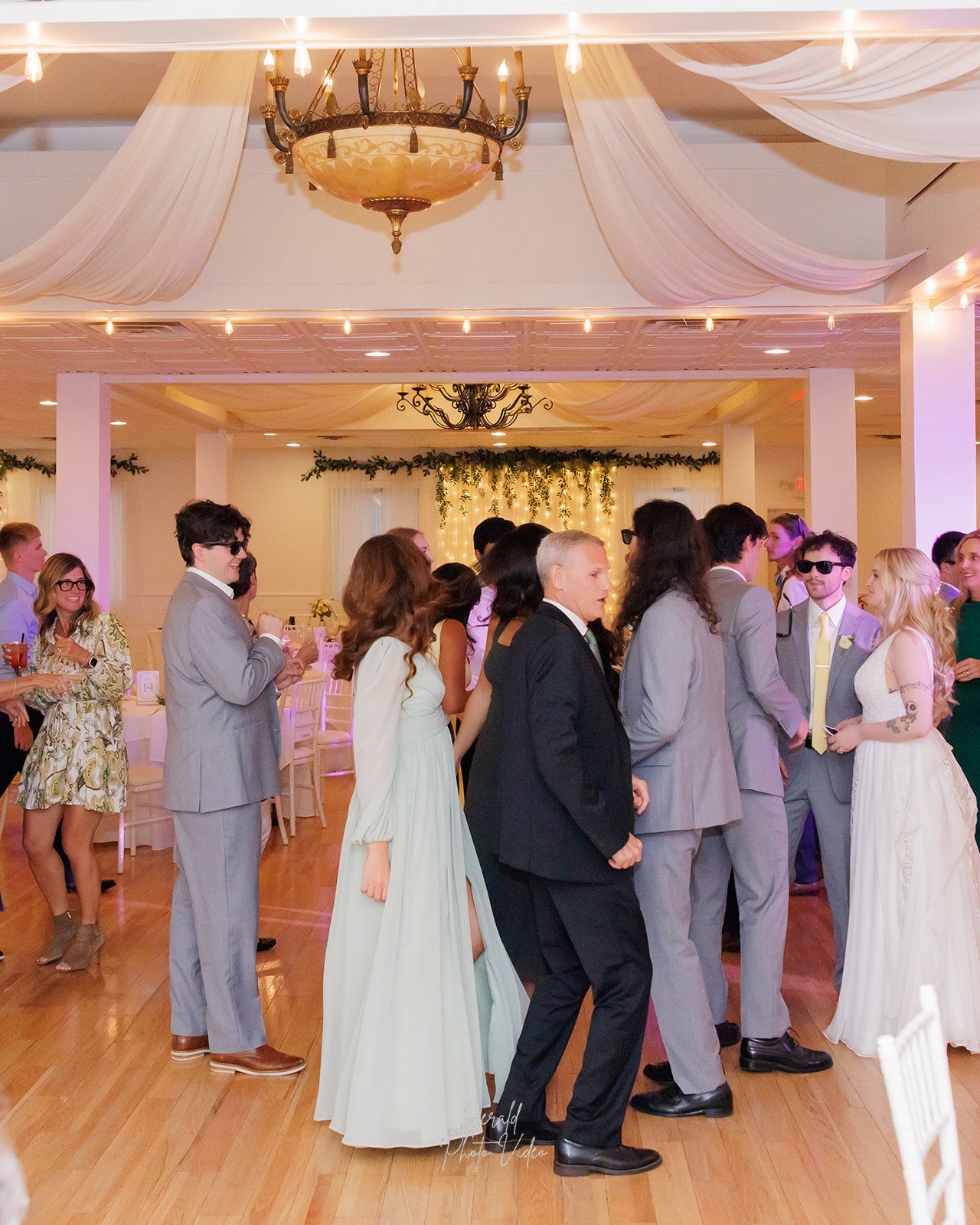 Wedding guests filling the dance floor at The Arbor Event Venue, Omaha