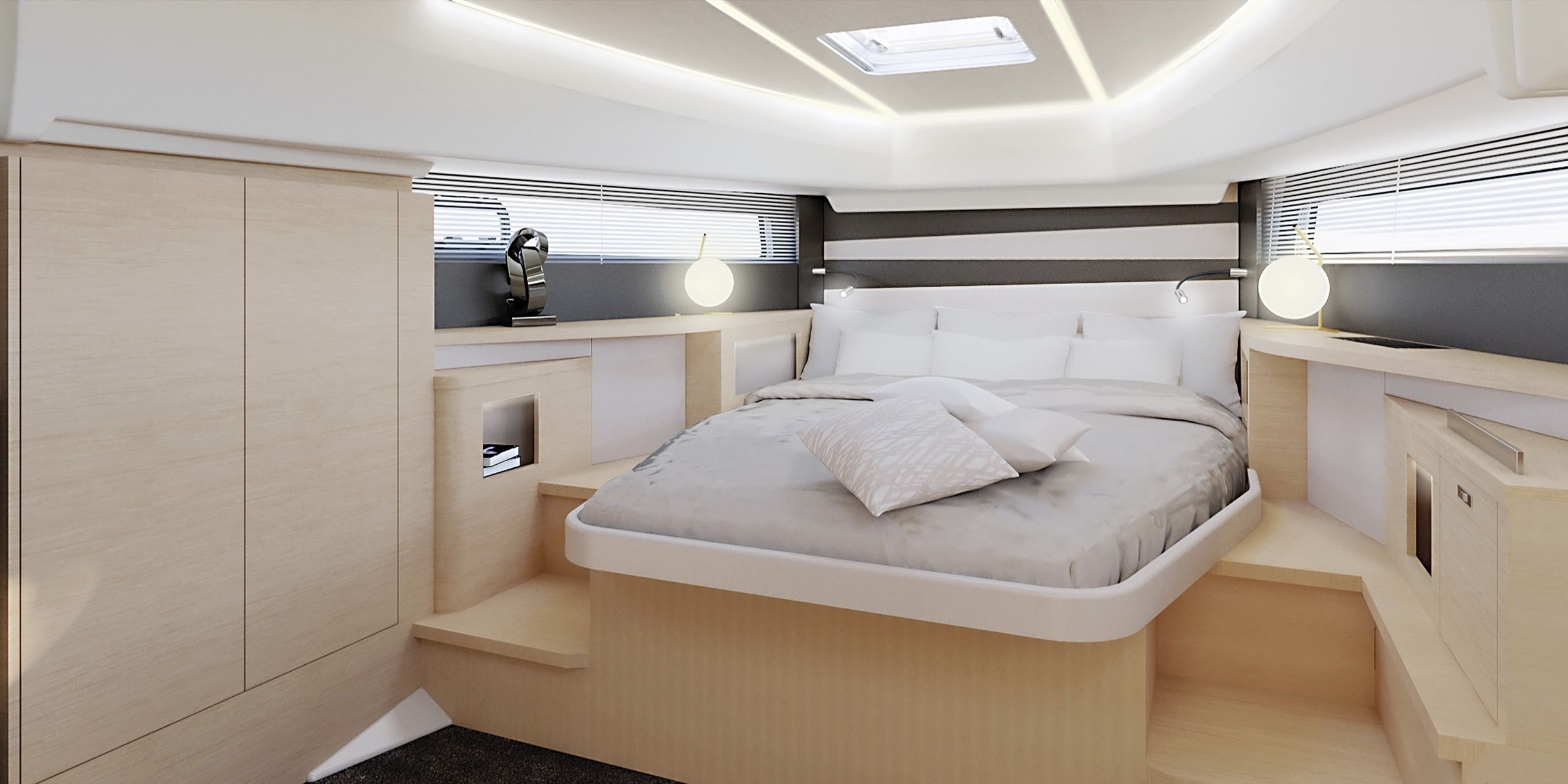 Luxurious sleeping cabin on the Jeanneau DB/37 OB with a large berth, bright furnishings and lighting.