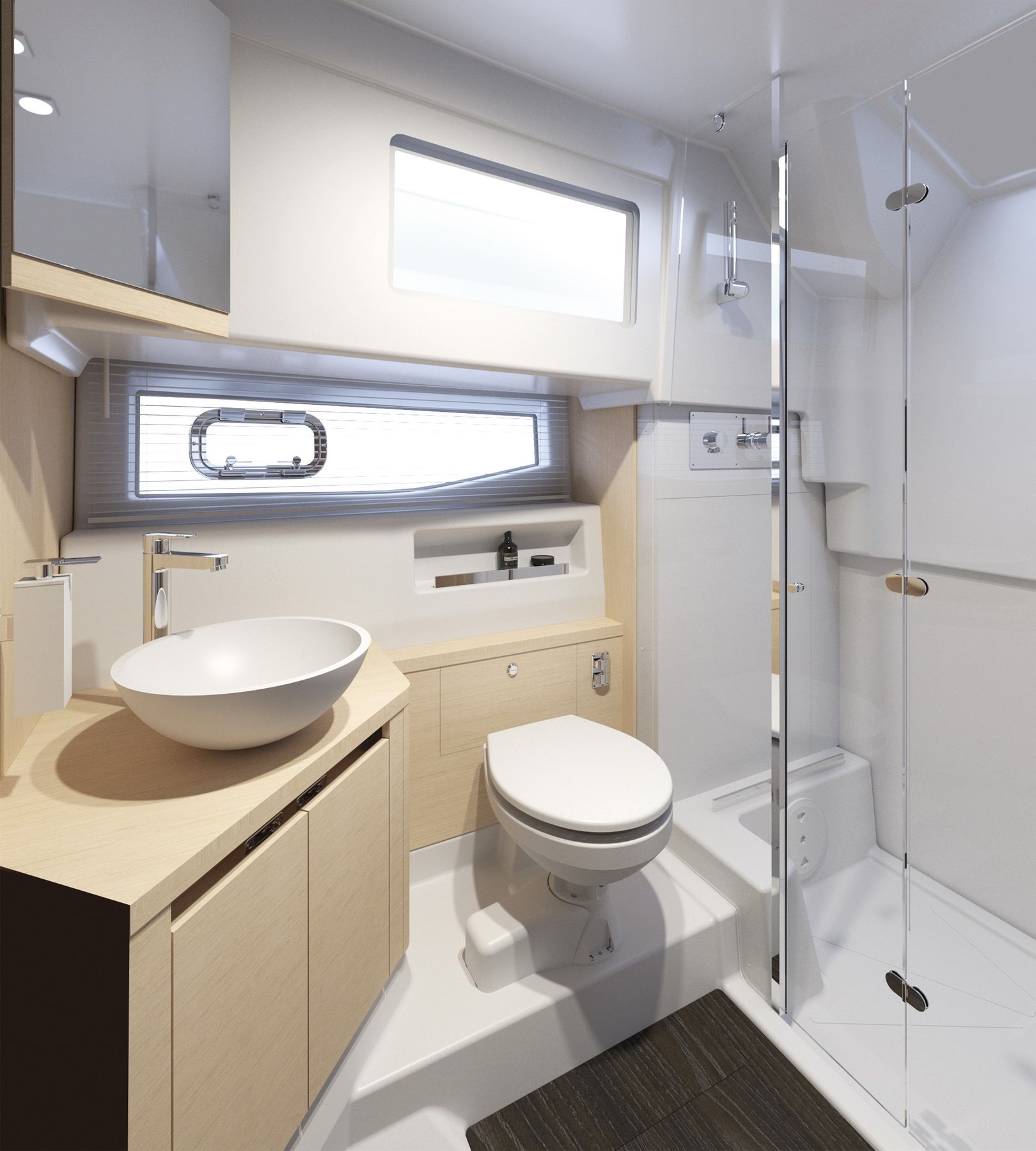 Modern bathroom on the Jeanneau DB/37 OB with a washbasin, toilet and shower cabin. Bright interior with wooden accents.