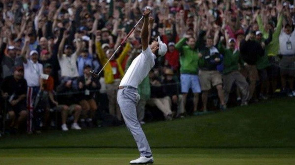 A golfer cheering.