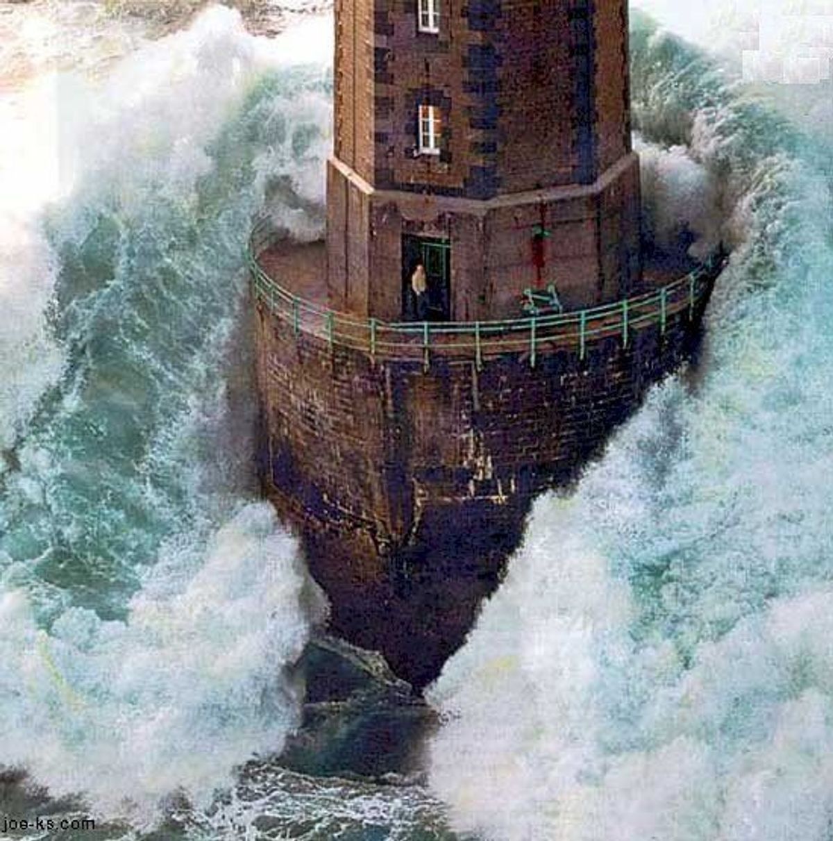 A painting of a lighthouse with waves crashing around it.