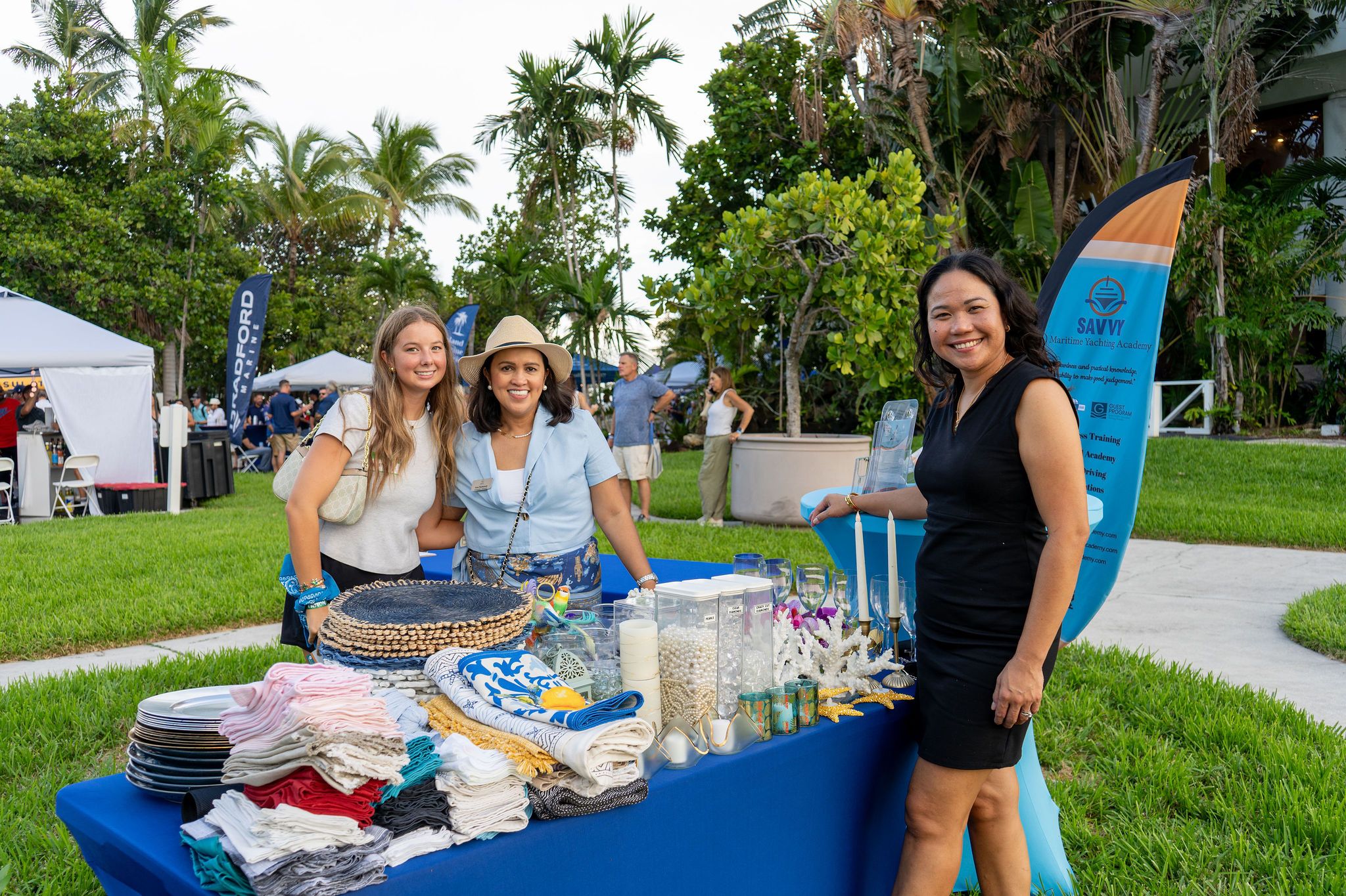 Guests in candid and group photos at The Triton's Fall Triton Expo at Bahia Mar Yachting Center.