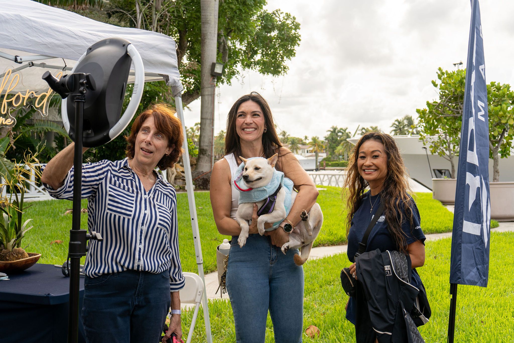 Guests in candid and group photos at The Triton's Fall Triton Expo at Bahia Mar Yachting Center.