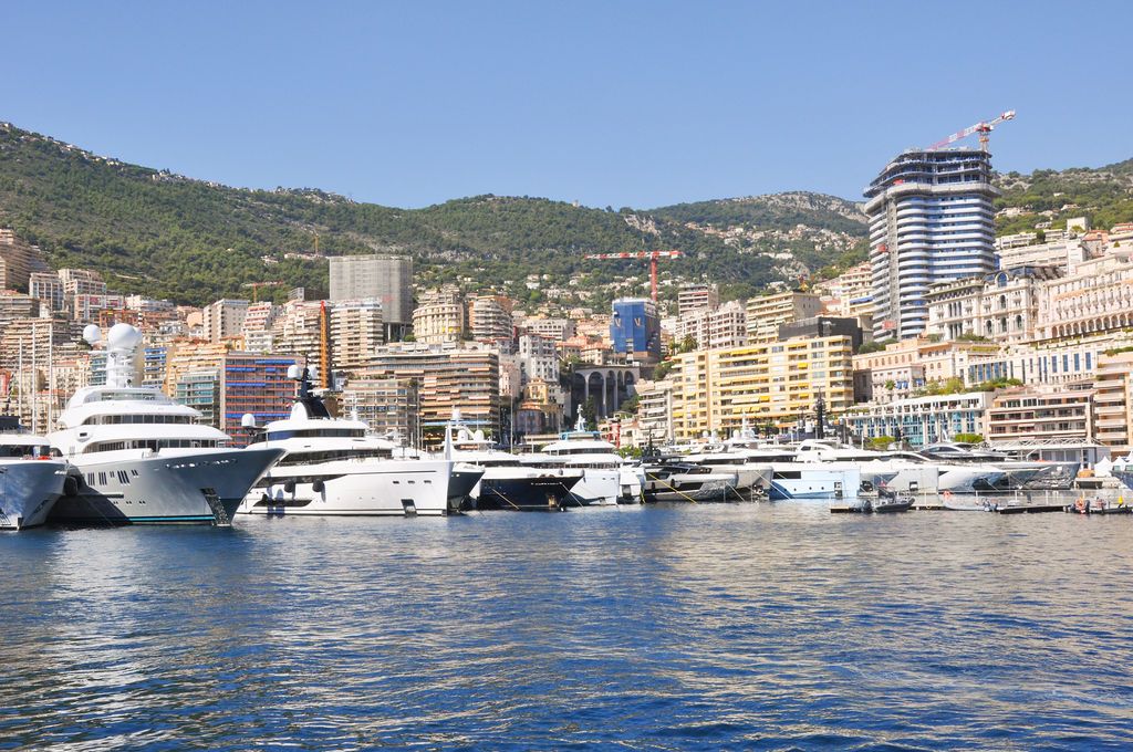 Superyachts moored in Port Hercule during the 2026 Monaco Yacht Show.