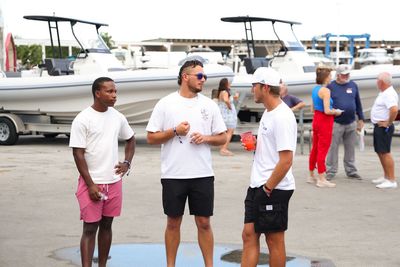 Guests networking at The Triton's Crew, Captains & Connections event at Nautical Ventures Marina.